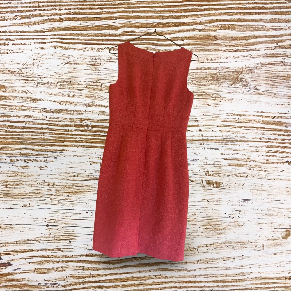 Sleeveless Ann Taylor coral dress with brocade pattern.